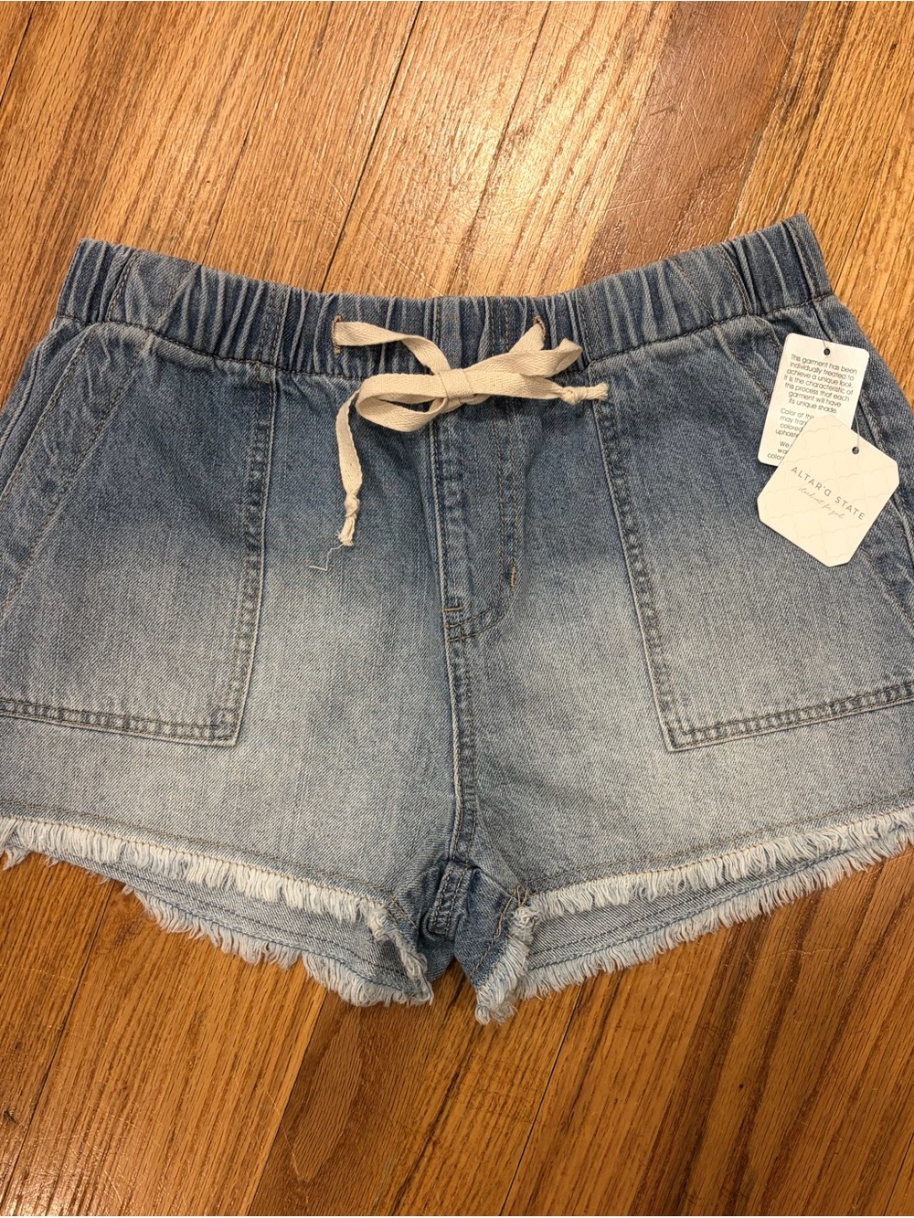 Altar'd State Light Wash Denim Shorts with Cream Drawstring